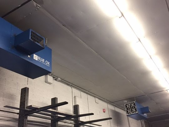 Blue Ox Air Cleaners installed along a wall to capture harmful air contaminants.