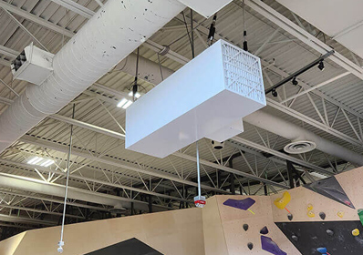 A Blue Ox air filtration system installed in a climbing gym to help control dust.