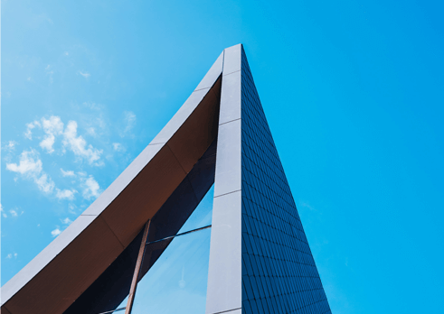 A commercial building with a clear blue sky in the background.