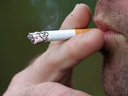 A person smoking a cigarette.