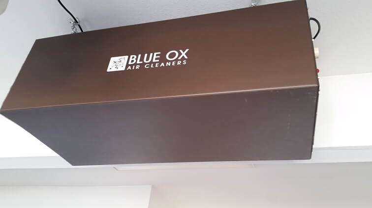 A close up of a Blue Ox smoke eater installed in a man cave to remove the smoke and odors from cigars and cigarettes.