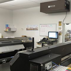 Canvas Print Shop shown with a Blue Ox OX1100-CC air filtration system installed above a work area.